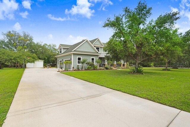 18929 Crescent Rd, Odessa, FL 33556 - craftsman inspired home with a front lawn and a garage