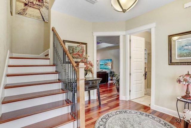 18929 Crescent Rd, Odessa, FL 33556 - stairs with wood finished floors and baseboards