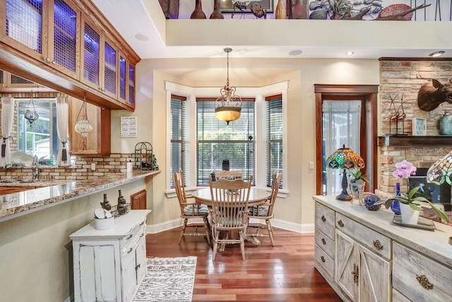 18929 Crescent Rd, Odessa, FL 33556 - dining area featuring dark wood-type flooring and baseboards