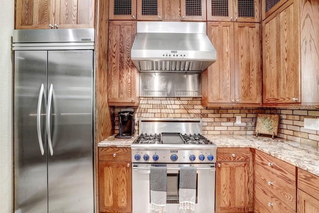 18929 Crescent Rd, Odessa, FL 33556 - kitchen with appliances with stainless steel finishes, wall chimney exhaust hood, tasteful backsplash, and glass insert cabinets