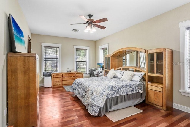 18929 Crescent Rd, Odessa, FL 33556 - bedroom with dark wood-type flooring, baseboards, and a ceiling fan