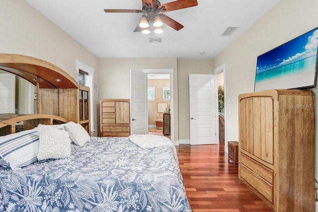 18929 Crescent Rd, Odessa, FL 33556 - bedroom featuring wood finished floors, baseboards, and a ceiling fan