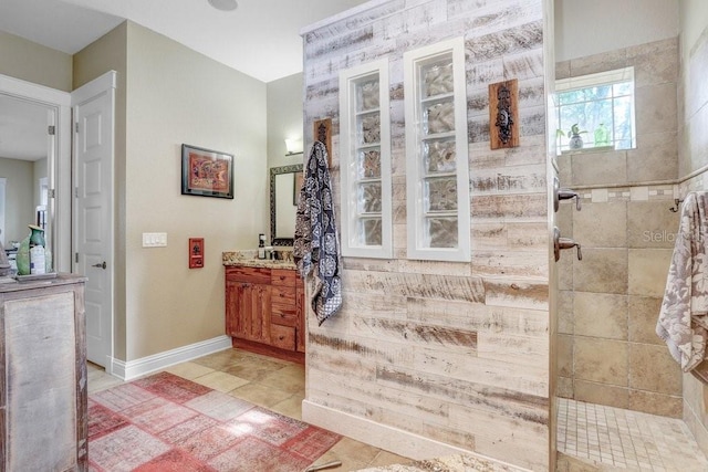 18929 Crescent Rd, Odessa, FL 33556 - full bathroom with a walk in shower, vanity, baseboards, and tile patterned floors