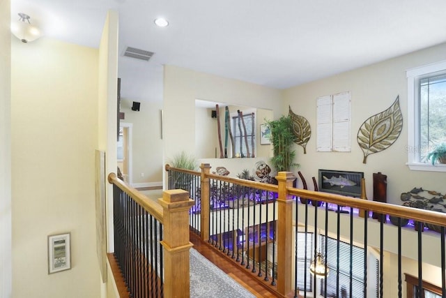 18929 Crescent Rd, Odessa, FL 33556 - hallway with an upstairs landing, recessed lighting, and wood finished floors