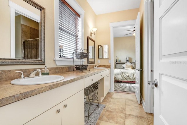 18929 Crescent Rd, Odessa, FL 33556 - bathroom featuring ceiling fan, double vanity, a shower, and ensuite bath