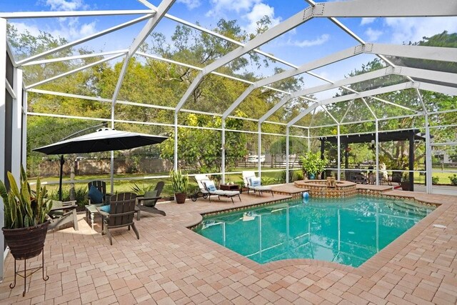 18929 Crescent Rd, Odessa, FL 33556 - outdoor pool with an in-ground hot tub, a patio area, and a lanai