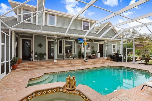 18929 Crescent Rd, Odessa, FL 33556 - back of house featuring a lanai, a patio, and roof with shingles