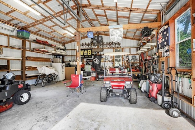 18929 Crescent Rd, Odessa, FL 33556 - garage featuring metal wall and a garage door opener