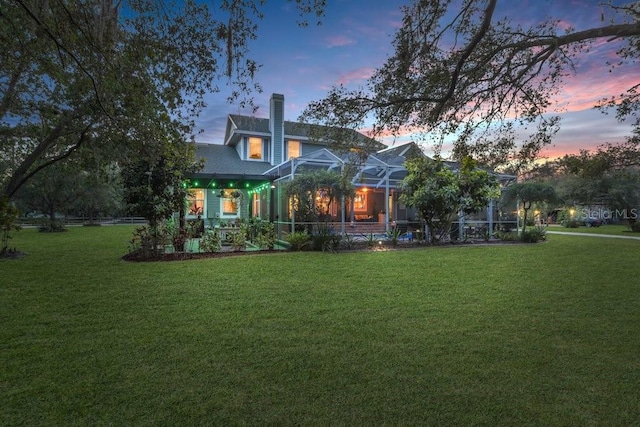 18929 Crescent Rd, Odessa, FL 33556 - rear view of house featuring a yard and glass enclosure