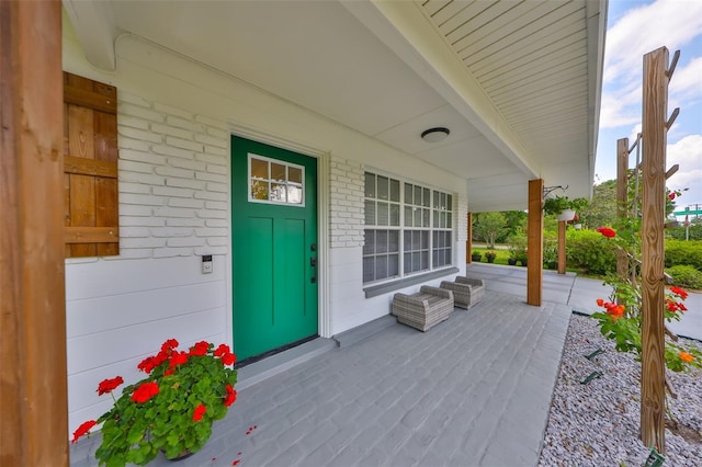entrance to property featuring covered porch