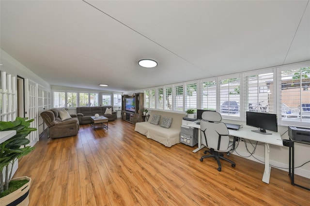 home office with light wood-style flooring