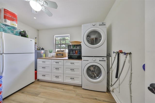 laundry room with light wood-style floors, stacked washer and clothes dryer, a ceiling fan, and laundry area