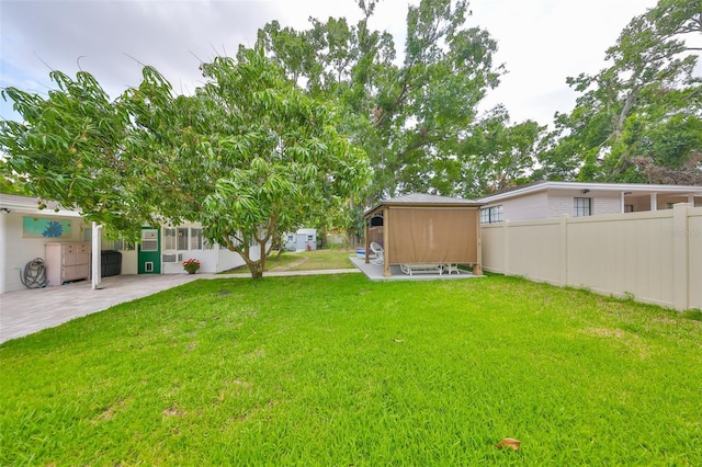 view of yard with fence and a patio area