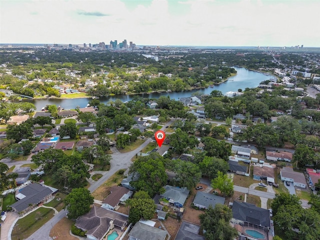 drone / aerial view with a residential view and a water view
