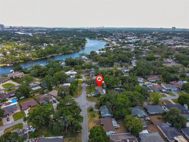 birds eye view of property with a water view and a residential view