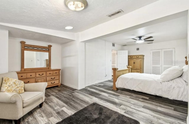 1247 21st St, Sarasota, FL 34234 - bedroom featuring wood finished floors, baseboards, a textured ceiling, and a ceiling fan