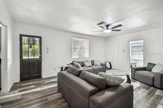 1247 21st St, Sarasota, FL 34234 - living area featuring healthy amount of natural light, wood finished floors, a textured ceiling, and a ceiling fan