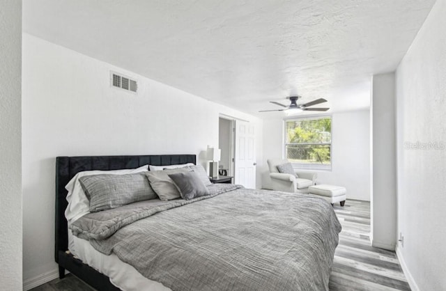 1247 21st St, Sarasota, FL 34234 - bedroom with wood finished floors and a ceiling fan