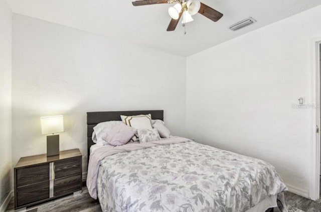 1247 21st St, Sarasota, FL 34234 - bedroom with wood finished floors, baseboards, and a ceiling fan