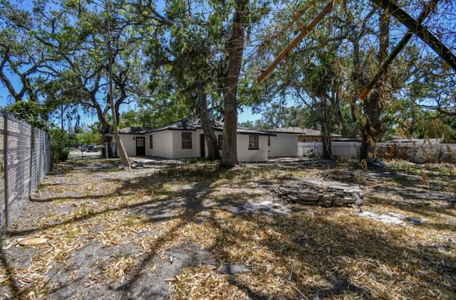 1247 21st St, Sarasota, FL 34234 - rear view of house with a fenced backyard