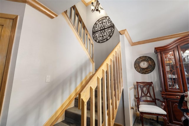 staircase featuring ornamental molding
