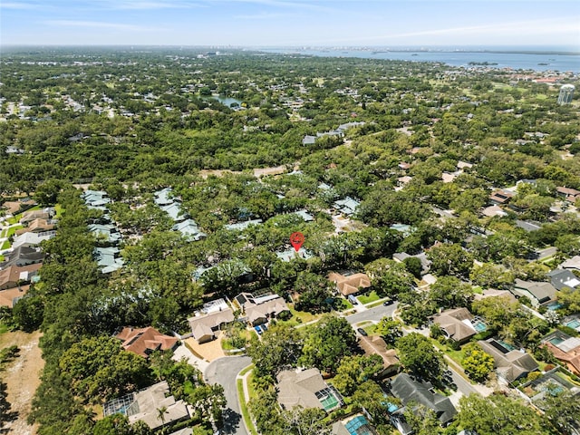 drone / aerial view with a water view and a residential view