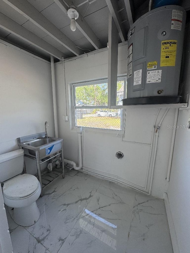 547 16th Ave S, Saint Petersburg, FL 33701 - bathroom featuring marble finish floors and toilet