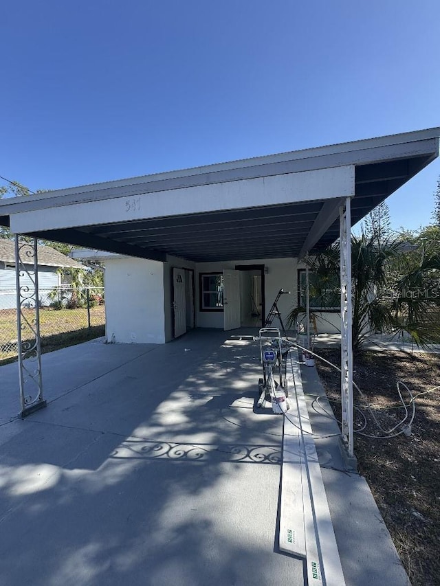 547 16th Ave S, Saint Petersburg, FL 33701 - view of patio featuring a carport