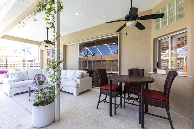 view of patio / terrace with an outdoor living space and a ceiling fan