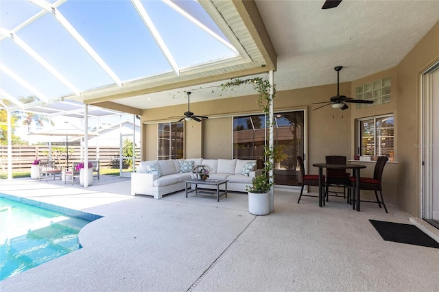 exterior space featuring ceiling fan, a fenced in pool, a lanai, and an outdoor hangout area