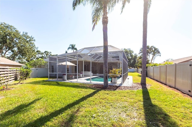 exterior space with a fenced in pool, a fenced backyard, a patio area, and a yard