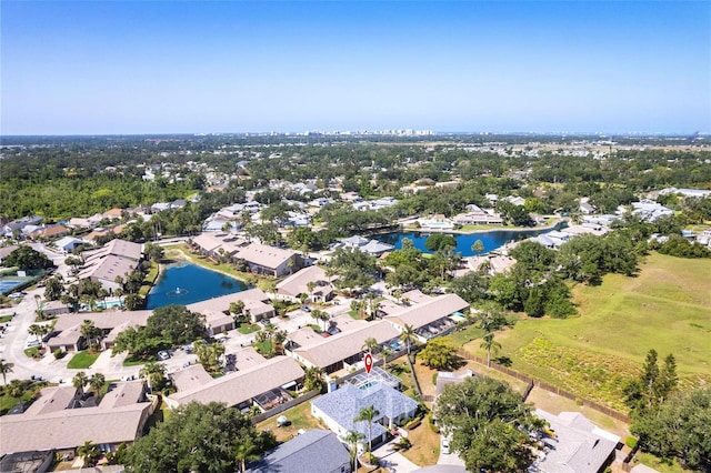 drone / aerial view featuring a water view and a residential view