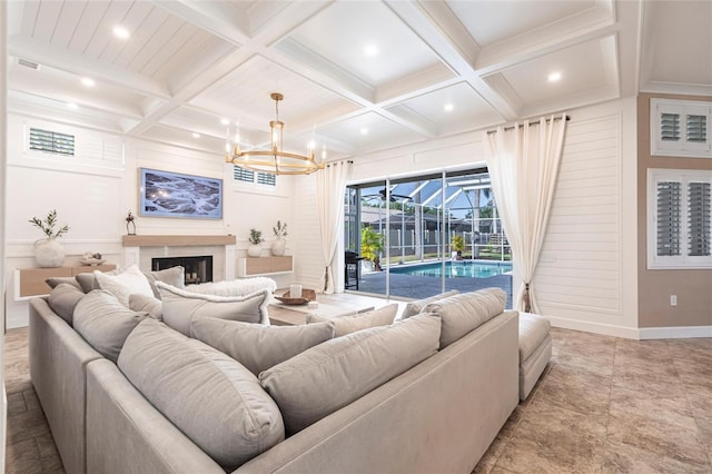 living area with an inviting chandelier, coffered ceiling, a sunroom, and beam ceiling