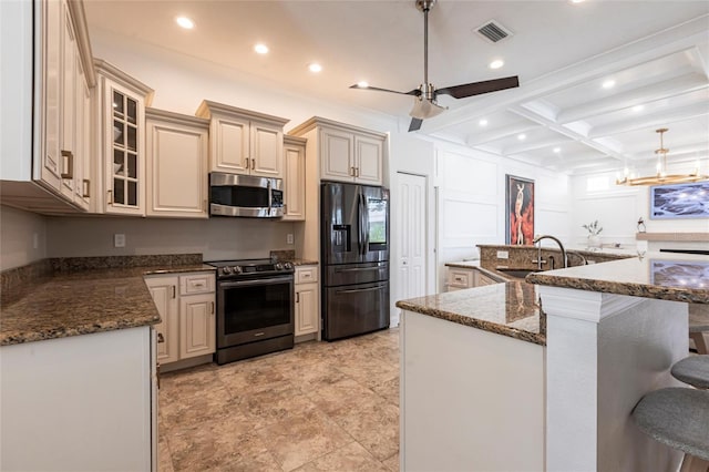 kitchen with visible vents, beamed ceiling, recessed lighting, a sink, and appliances with stainless steel finishes