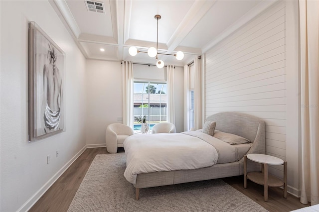 bedroom with baseboards, wood finished floors, beamed ceiling, visible vents, and coffered ceiling