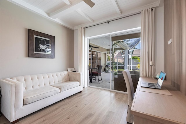 living room featuring beamed ceiling, ceiling fan, and wood finished floors