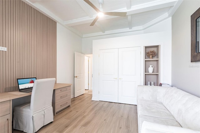 office with ceiling fan, beamed ceiling, light wood-type flooring, and built in desk
