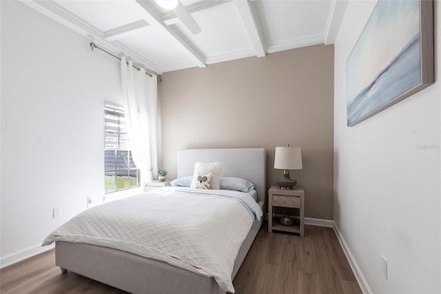 bedroom with baseboards, beam ceiling, a ceiling fan, and wood finished floors