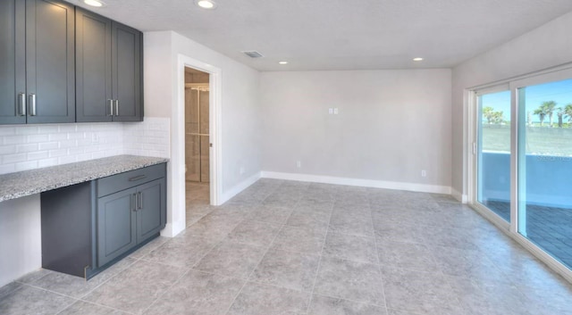 interior space with recessed lighting, baseboards, visible vents, and light tile patterned flooring