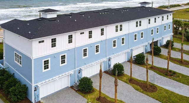 bird's eye view with a water view and a view of the beach