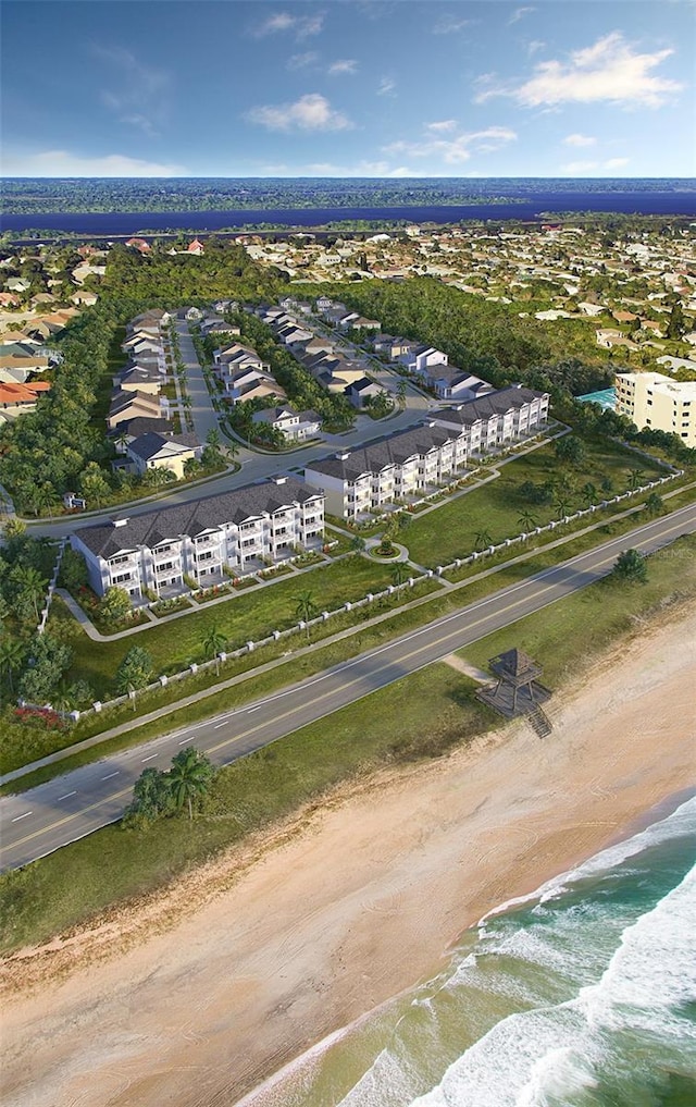 drone / aerial view featuring a view of the beach and a water view