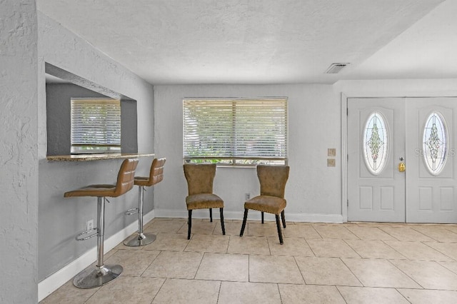 2026 Cocoanut Ave, Sarasota, FL 34234 - entrance foyer with a wealth of natural light and tile patterned floors