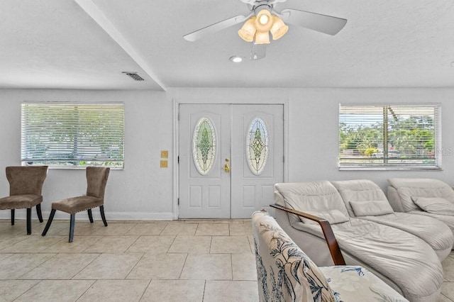 2026 Cocoanut Ave, Sarasota, FL 34234 - entryway with ceiling fan, a wealth of natural light, light tile patterned floors, and visible vents