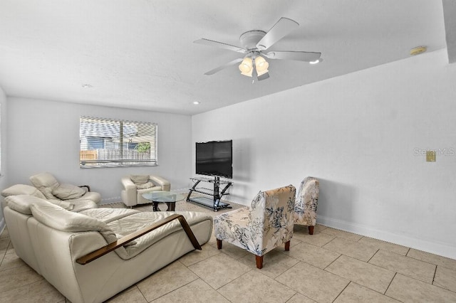 2026 Cocoanut Ave, Sarasota, FL 34234 - living room with light tile patterned floors, baseboards, and ceiling fan