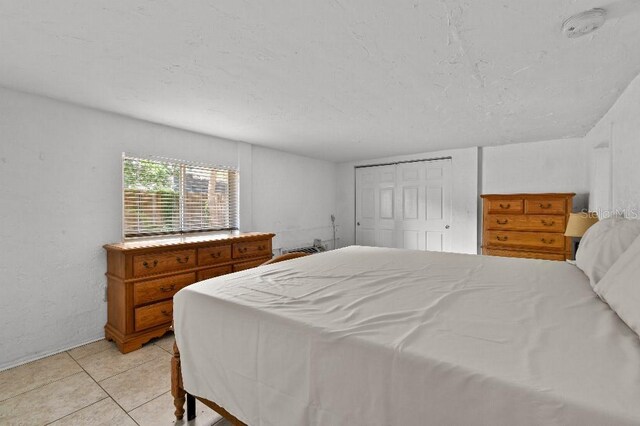 2026 Cocoanut Ave, Sarasota, FL 34234 - bedroom featuring light tile patterned floors and a closet