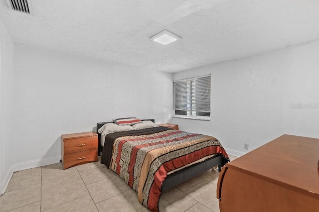 2026 Cocoanut Ave, Sarasota, FL 34234 - bedroom with a textured ceiling, visible vents, baseboards, and light tile patterned flooring