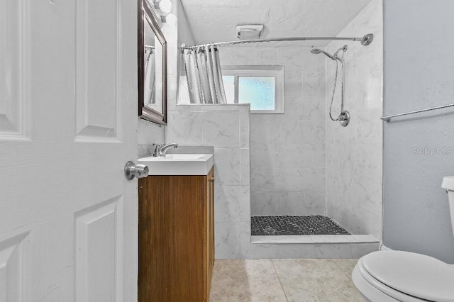 2026 Cocoanut Ave, Sarasota, FL 34234 - full bath with tile patterned floors, vanity, toilet, and a tile shower