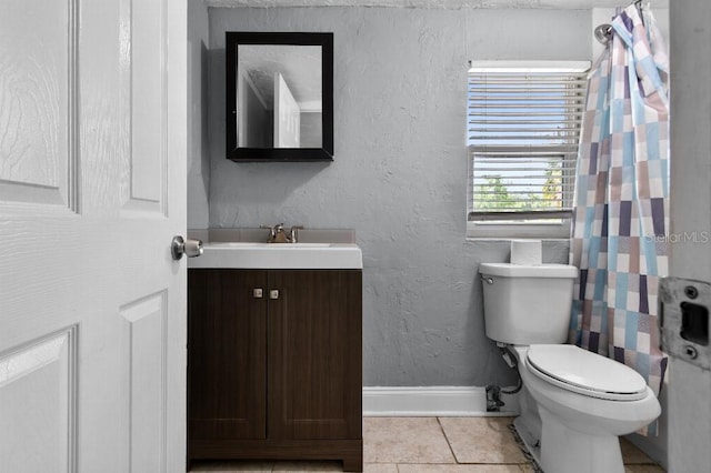 2026 Cocoanut Ave, Sarasota, FL 34234 - bathroom featuring toilet, baseboards, a shower with shower curtain, tile patterned flooring, and vanity