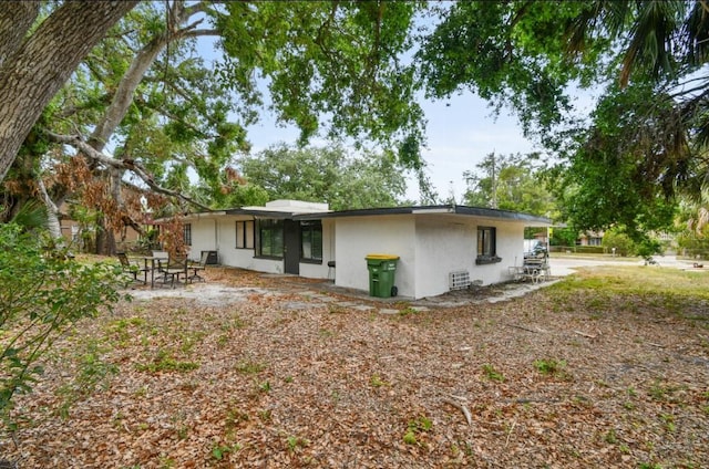 2026 Cocoanut Ave, Sarasota, FL 34234 - rear view of house featuring a patio area and stucco siding