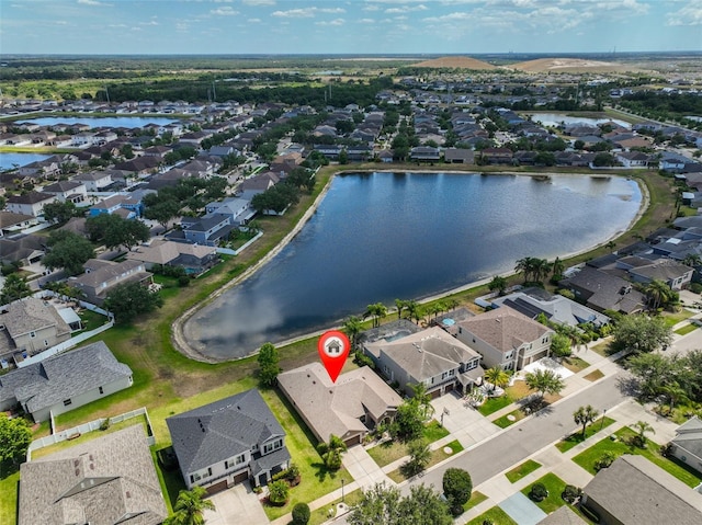 birds eye view of property with a residential view and a water view